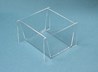 Clear acrylic bin in front of a light blue background