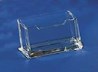 A clear acrylic display mount in front of a blue background