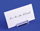 Business card on acrylic mount in front of a blue background